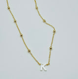 Gold plated chain with mother of pearl initial