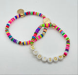 rainbow bracelet with name in gold letters on white beads