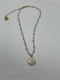 Gold plated chain with fake pearls with a mother of pearl charm of the Virgin Mary