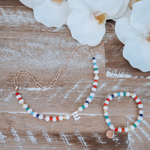 Rainbow necklace with baroque pearls and initial available to personalize also contains a gold plated chain